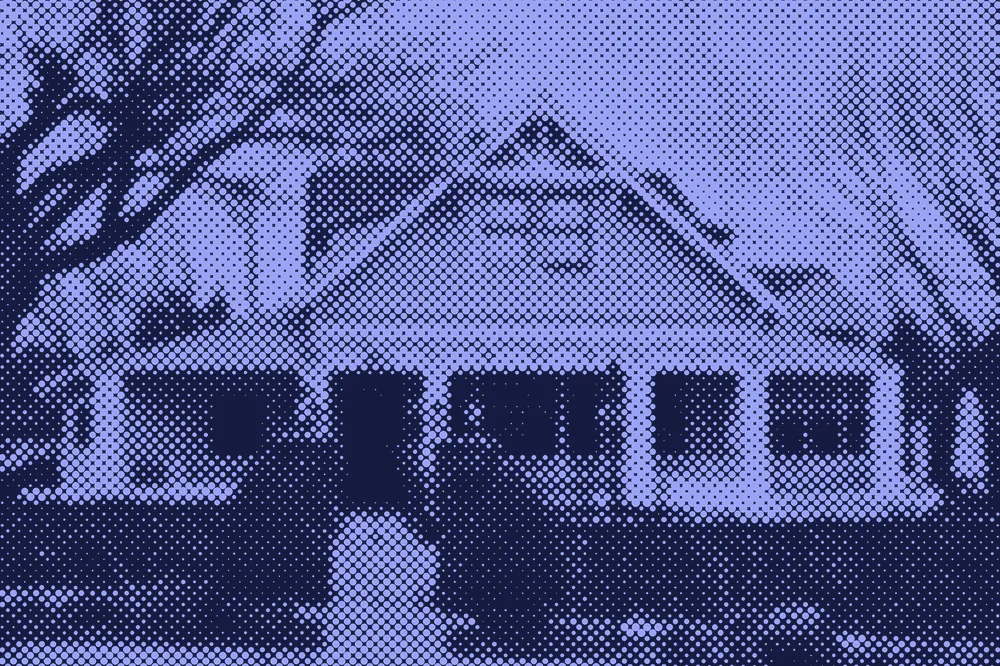 A yellow craftsman house with a wide front porch